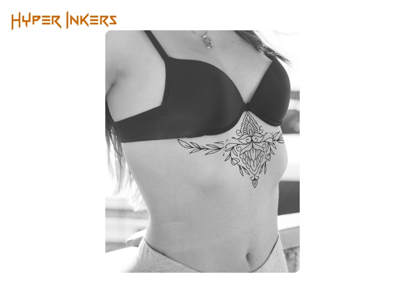 Mandala tattoo built from repeating symmetrical rings on the sternum