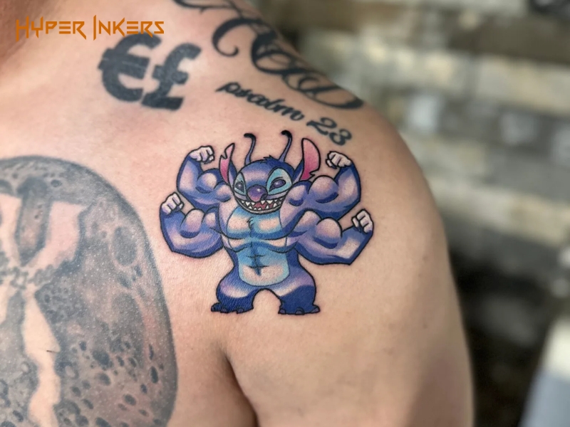 New school tattoo of a cartoon character in saturated color on the shoulder